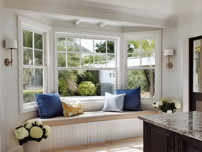 Cozy window seat with plush cushions in a beautifully installed bay window
